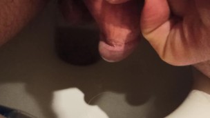 I pee and stroke my dickhead.