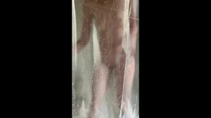 iPhone catches horny tattooed step-mom masturbating in the shower in hot portrait video
