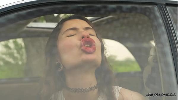 Messy Pink lipgloss marks on the Car Window
