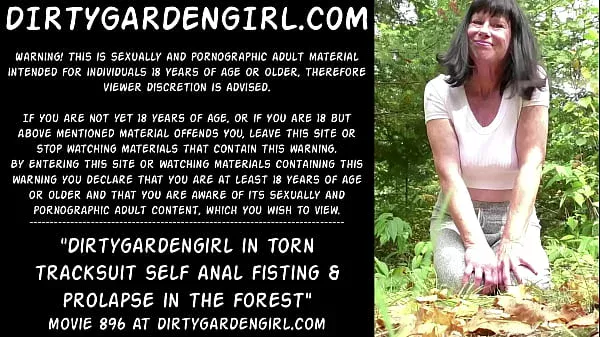 Dirtygardengirl in torn tracksuit self anal fisting & prolapse in the forest