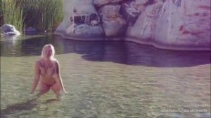 Naked blonde girl explores waterfall- relaxing and beautiful