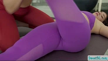 Curly haired brunette sits on lesbian trainers face