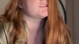 Curvy redhead with massive boobs strips and rides a dildo