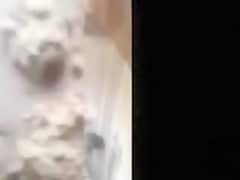 Woman filmed in secret while bathing in a outdoor scene