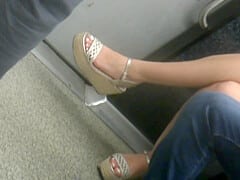 Young brunette, sexy legs in wedges heels