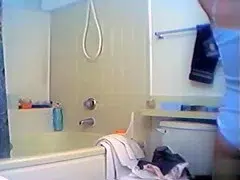 Brunette brass enjoys taking a relaxing shower