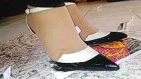 Girl stomping on paper and trampling in metal high heels