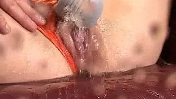 Asia Girl Pulls Her Panties Aside To Squirt The Camera