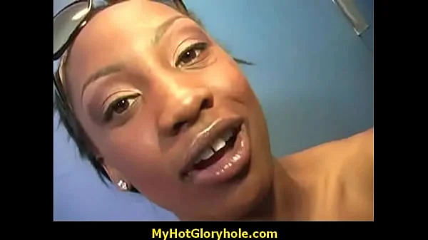 Gloryhole – Ebony sucking a strangers hard cock through the hole in the wall 21