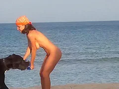 Perfect slim girl playing on the beach
