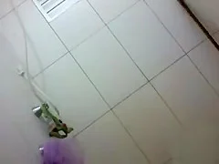 Petite chick dances under the shower
