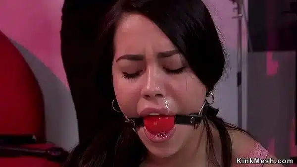 Photographer puts in rope bondage sexy brunette actress and then spanks and whips her ass