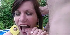 A woman, managing the home, engages in sexual activity with two large, full penises.