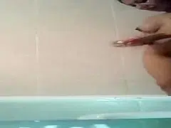 Curvaceous beauty washes her attractive body