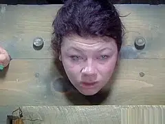 Restrained sub whipped while anally hooked