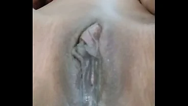 Horny girl fucks her juicy pussy close-up creamy